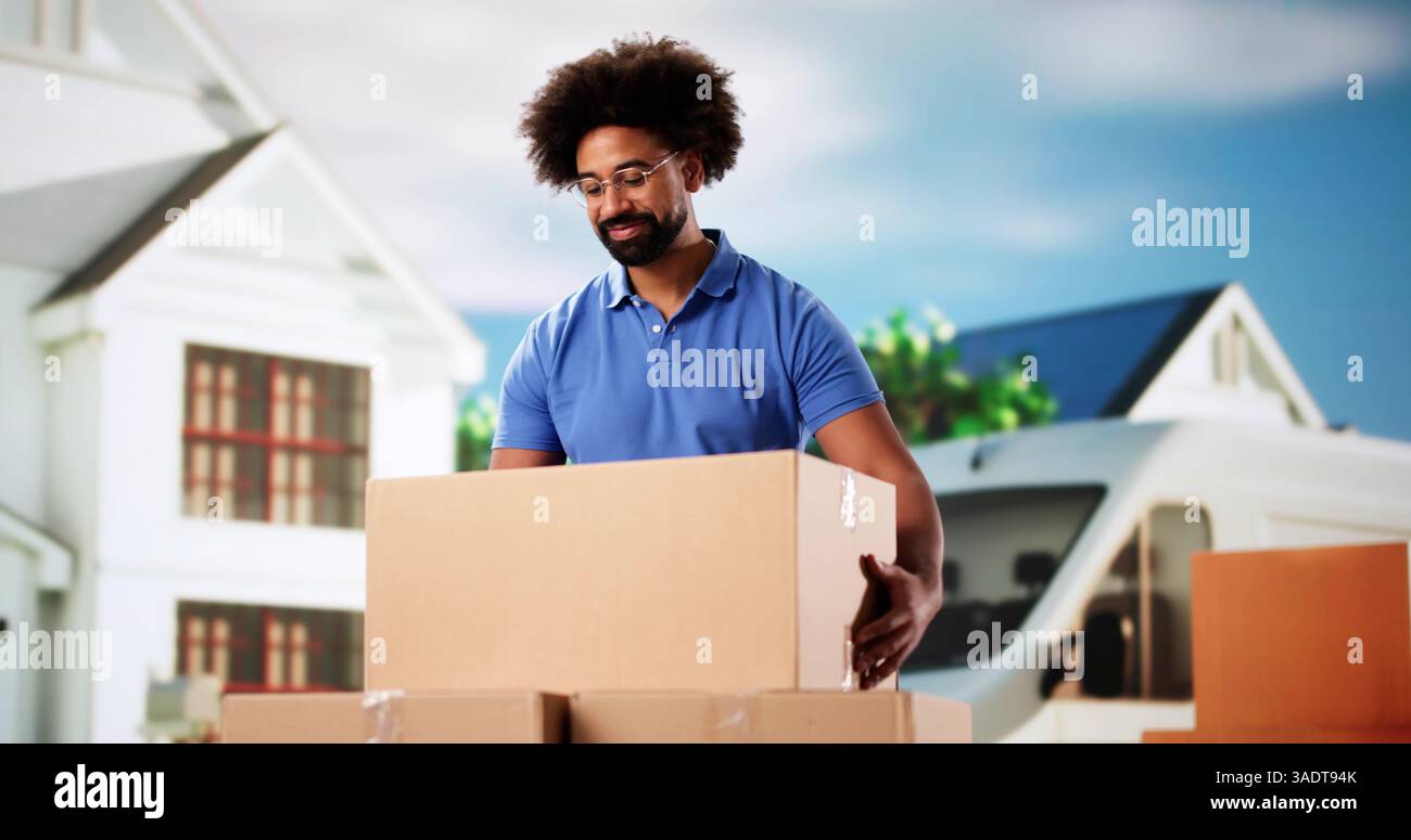 Professional Mover Unloading Boxes from Van in a Residential Neighborhood. Stock Photo