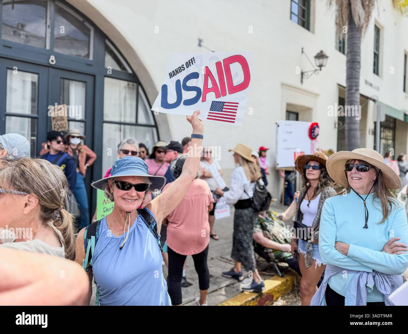 Santa Barbara, Ca, USA. 5th Apr, 2025. Hands Off US AID sign during the Hands Off Anti-Trump Admin Rally on April 5, 2025 at De La Guerra Plaza''” the largest protest in Santa Barbara modern history. (Credit Image: © Amy Katz/ZUMA Press Wire) EDITORIAL USAGE ONLY! Not for Commercial USAGE! Stock Photo