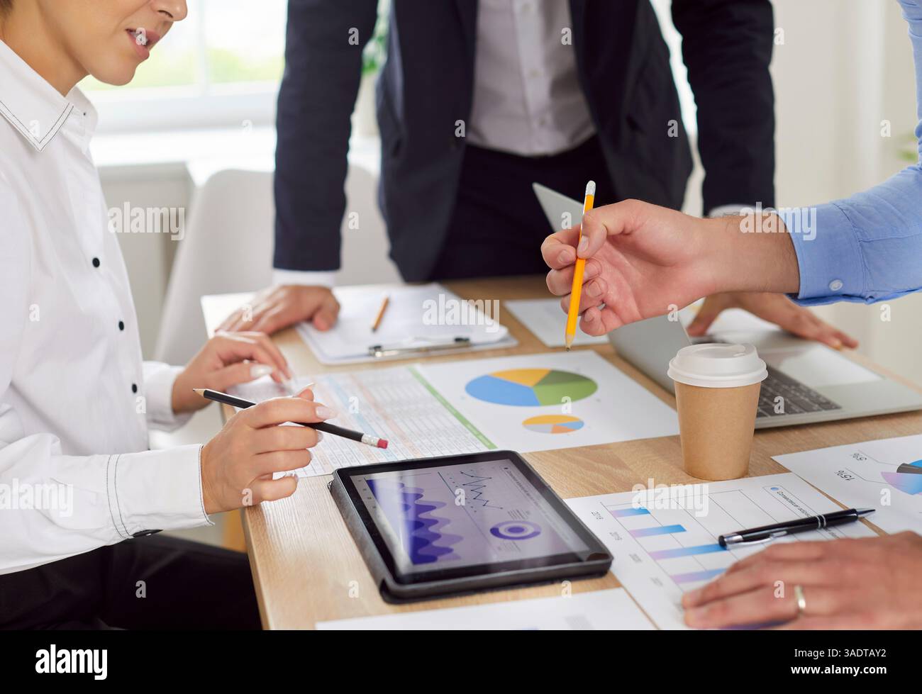 Company members workers team gathered at conference room desk doing ...