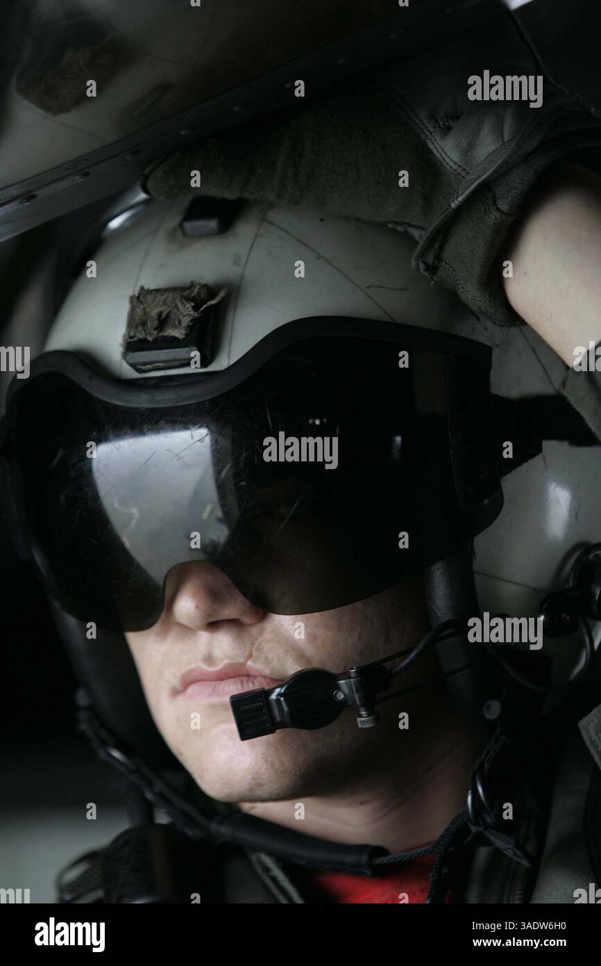 Sep 24, 2005; Mississippi Delta, LA, USA; Aviation Warfare Systems Operator Airman (NAC) Joshua Shreve of HM-14 watches out the window of a Navy H-53 helicopter while the damaged coastal areas pass by beneath while on a run from Pensacola, Naval Air Station to the amphibious assault ship Iwo Jima off the Lousiana Coast..  (Credit Image: Mark Faram/ZUMAPRESS.com) Stock Photo