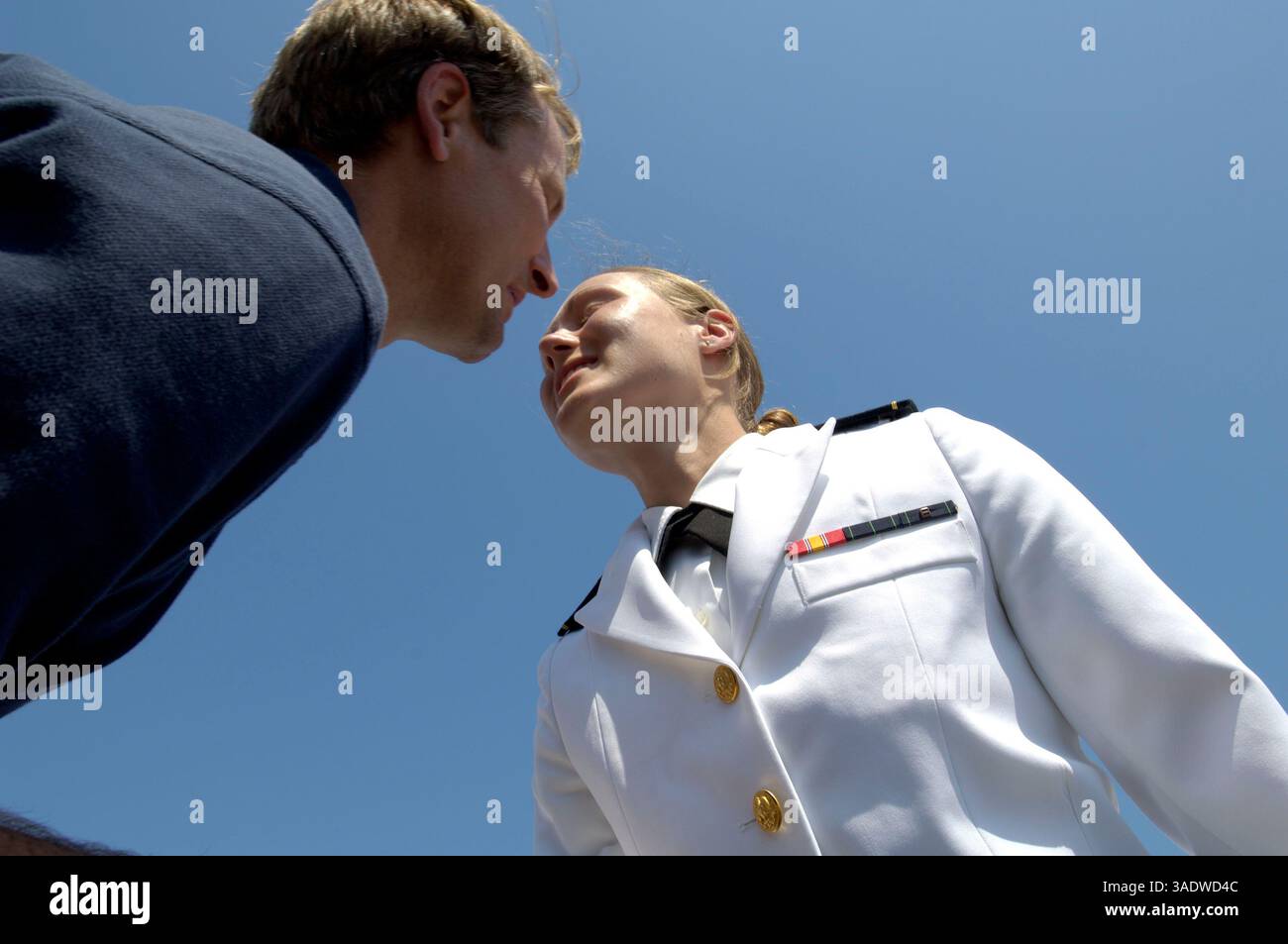 May 27, 2005; Annapolis, MD, USA; Jackie Sinnett leans across the aisle to  kiss her father, Navy Pilot Captain Kevin Sinnett, after raising her right  hand and taking the oath of office