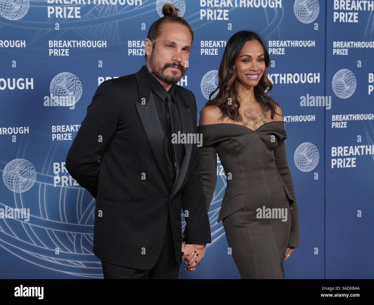 (L-R) Marco Perego and Zoe Saldana at the 11th Breakthrough Prize ...