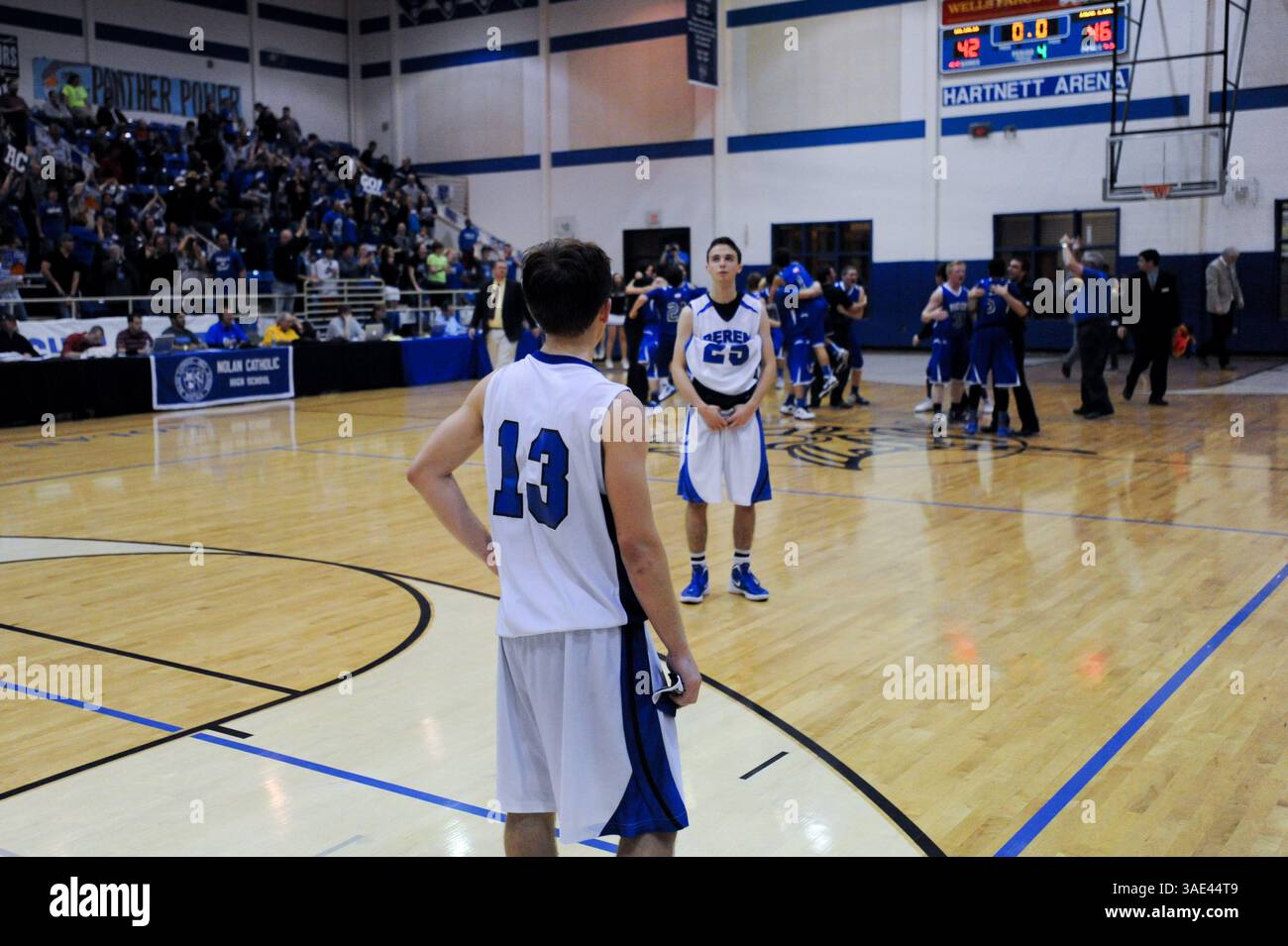 March 3, 2012 - Isaac Buchine (25), stares into the distance as Isaac Mirwis (13), watches the Abilene Christian Panthers celebrate their TAAPS 2A State Championship. Abilene Christian defeated Beren Academy, 46-42. Beren Academy gained national attention this past week when the Texas Associate of Private Schools (TAPPS), rejected Beren AcademyÃs request to reschedule the 2A semifinal game in observance of the Jewish Sabbath, sunset Friday to sunset Saturday.  Facing a possible legal battle stemming from a lawsuit being filed in U.S. District Court, TAPPS reversed their scheduling decision.No Stock Photo