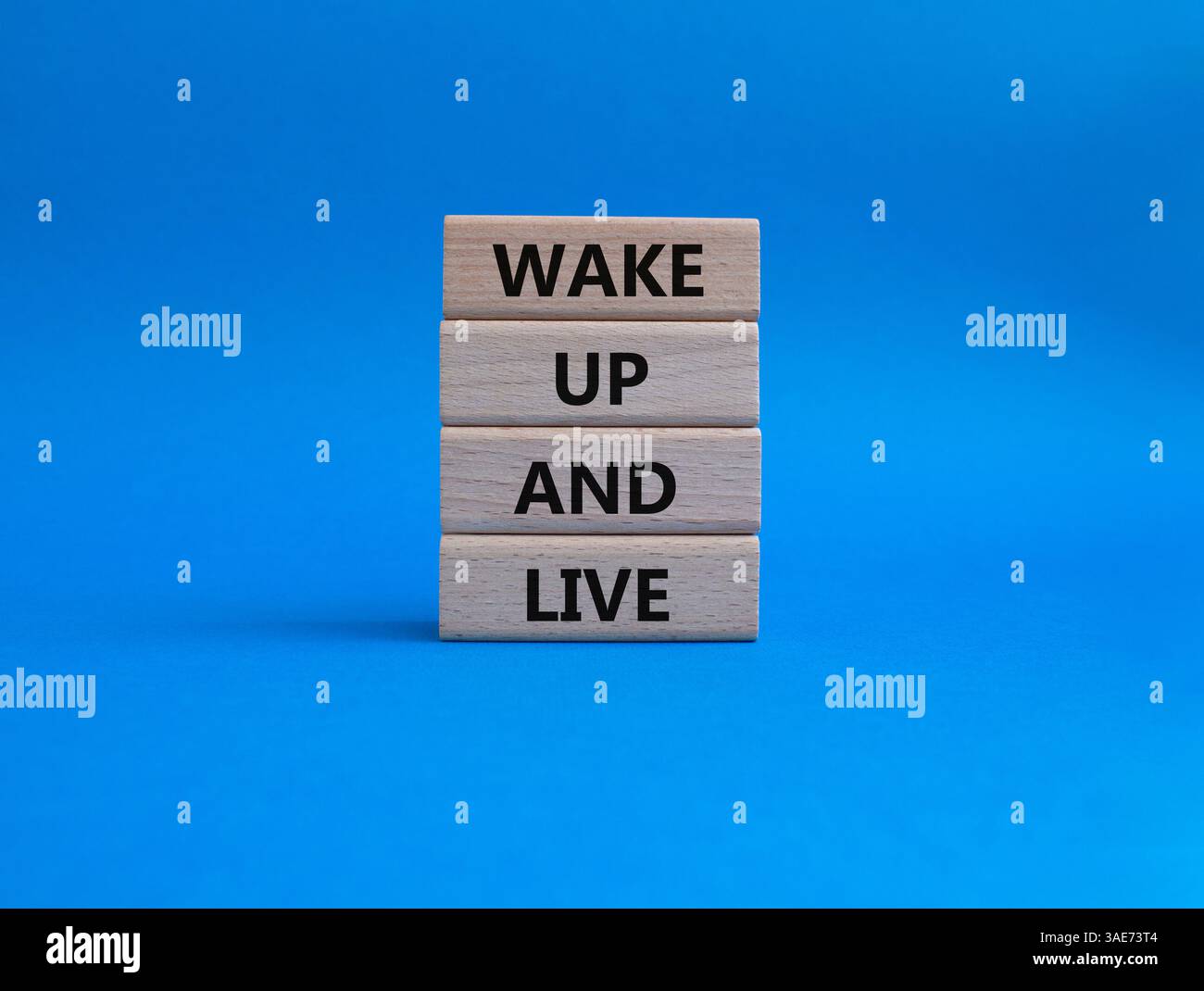 Wake up and live symbol. Wooden blocks with words Wake up and live