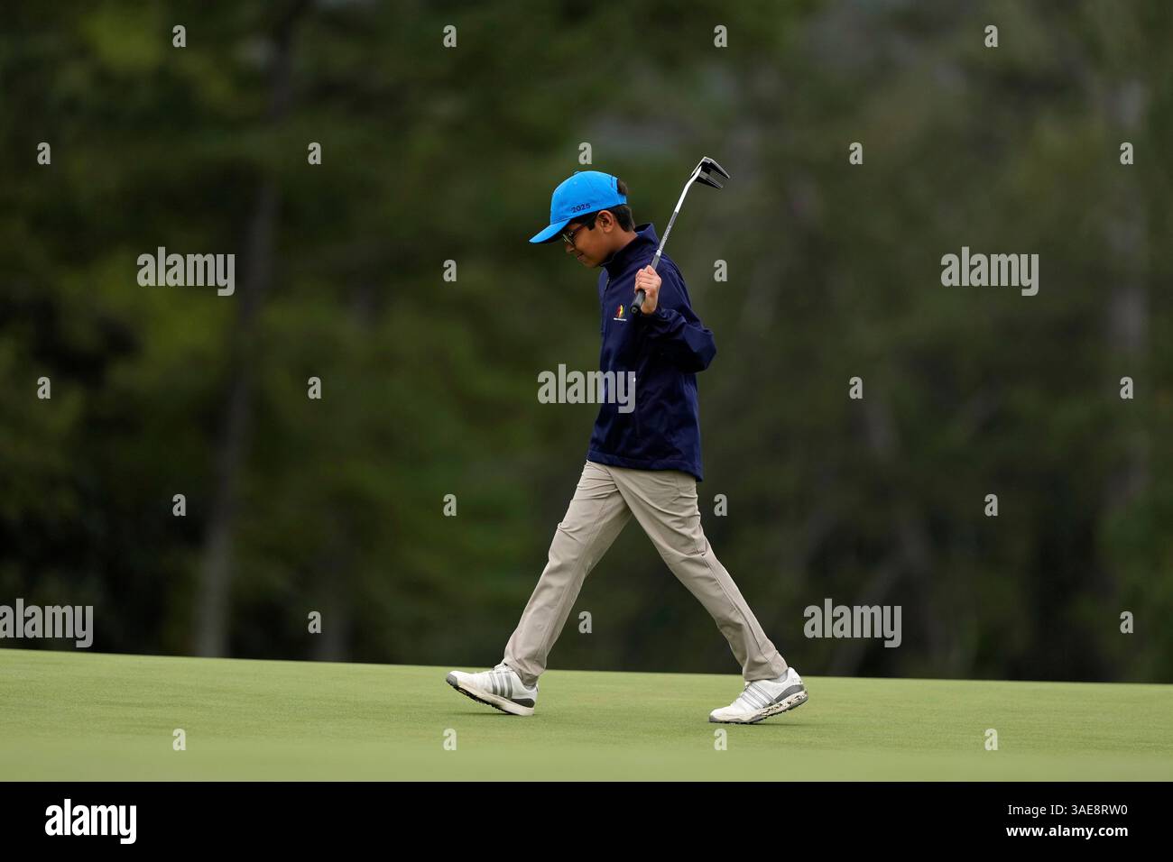 Nikhil Rao, of Lawrence, Kan., reacts after putting in the Boys 7-9 age ...