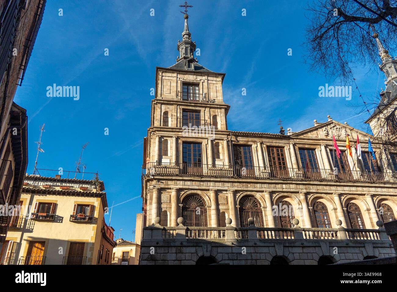 A large building with a cross is in the citys center Stock Photo - Alamy