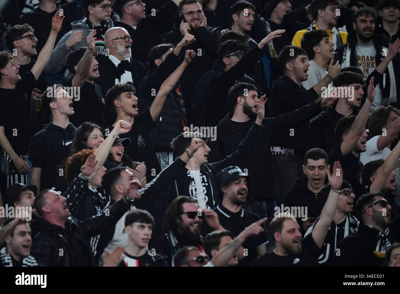 Juventus fans cheer before a Serie A soccer match between Roma and ...
