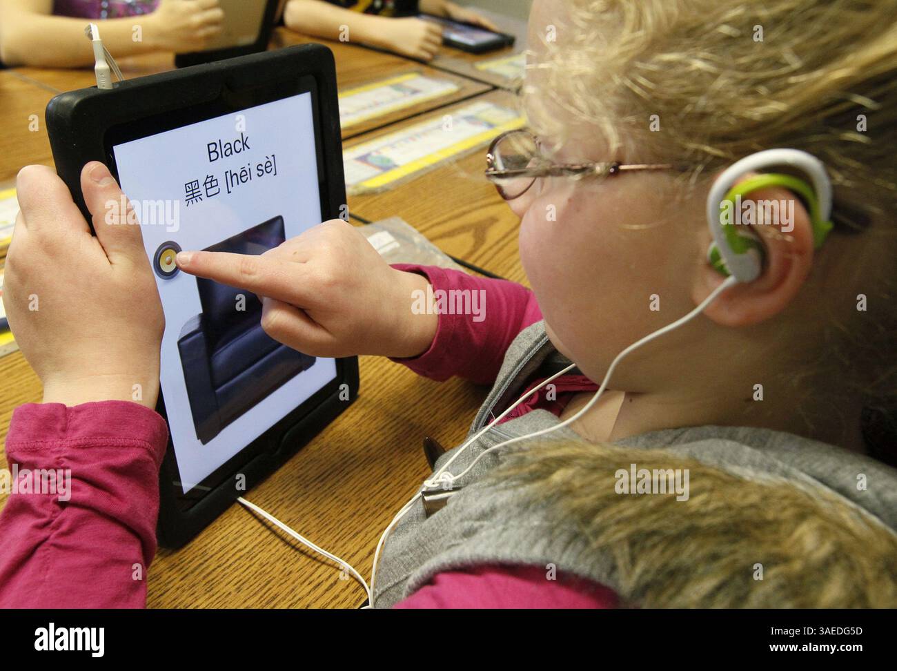 Jan. 5, 2012 - Green, OH, USA - Kristen Leibensperger, 8, learns Mandarin Chinese using an iPad in J.T. Kuzior's third grade class at Green Primary School in Green, Ohio, on Thursday, January 5, 2012. Local entrepreneur Randy Theken has donated the 90 iPads to the school. (Credit Image: © Paul Tople/Akron Beacon Journal/MCT/ZUMAPRESS.com) Stock Photo