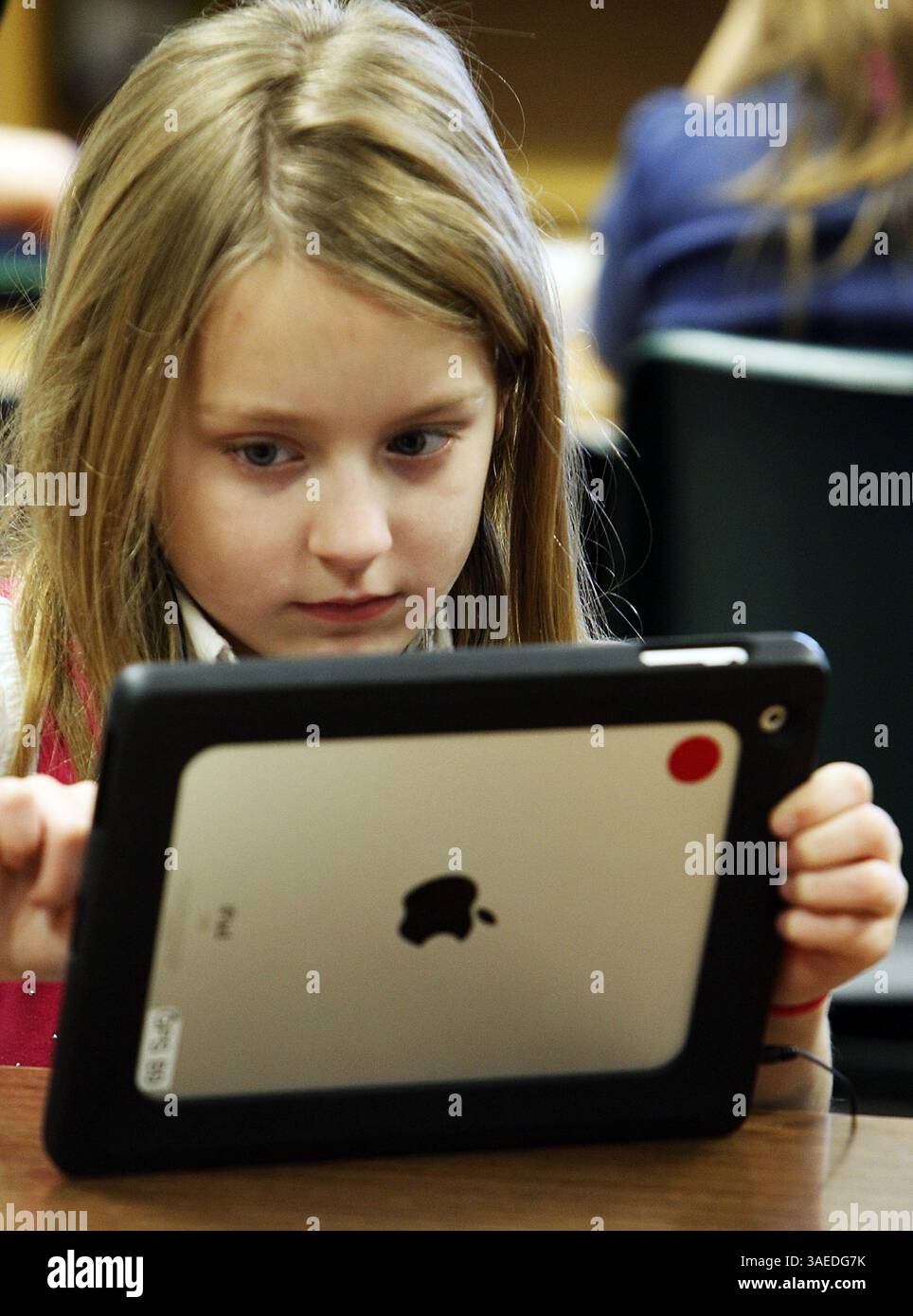 Jan. 5, 2012 - Green, OH, USA - Adrianna Futo, 8, learns Mandarin Chinese using an iPad in J.T. Kuzior's third grade class at Green Primary School in Green, Ohio, on Thursday, January 5, 2012. Local entrepreneur Randy Theken has donated the 90 iPads to the school. (Credit Image: © Paul Tople/Akron Beacon Journal/MCT/ZUMAPRESS.com) Stock Photo