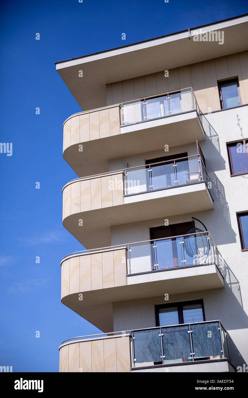 A Modern Apartment Building Featuring Stylish Balconies Set Against a ...