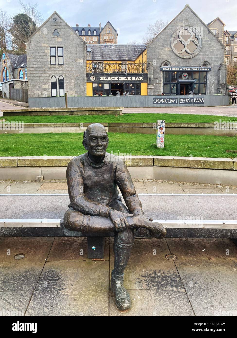 Man with sore feet statue marking the end on the West Highland Way, Fort William Scotland - Smartphone Captured Stock Image
