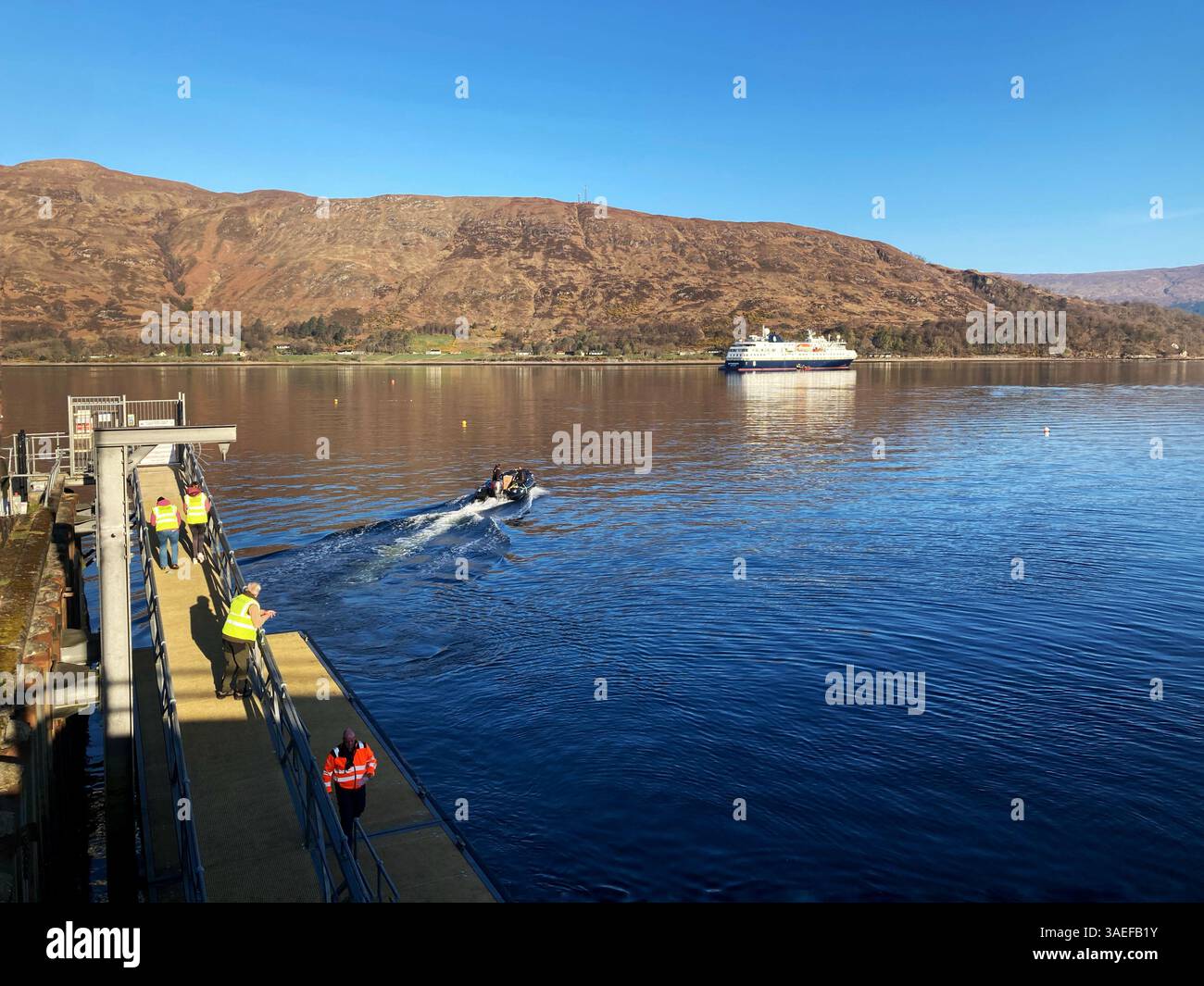 Fort William pontoon, with cruise ship MS Spitsbergen anchored in Loch Linnhe, Fort William Scotland - Smartphone Captured Stock Image