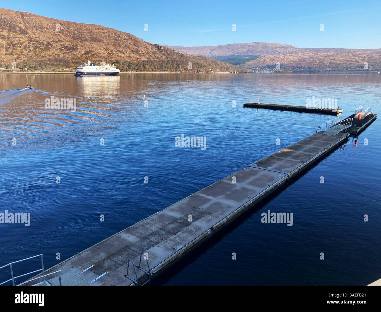 Fort William pontoon, with cruise ship MS Spitsbergen anchored in Loch Linnhe, Fort William Scotland - Smartphone Captured Stock Image