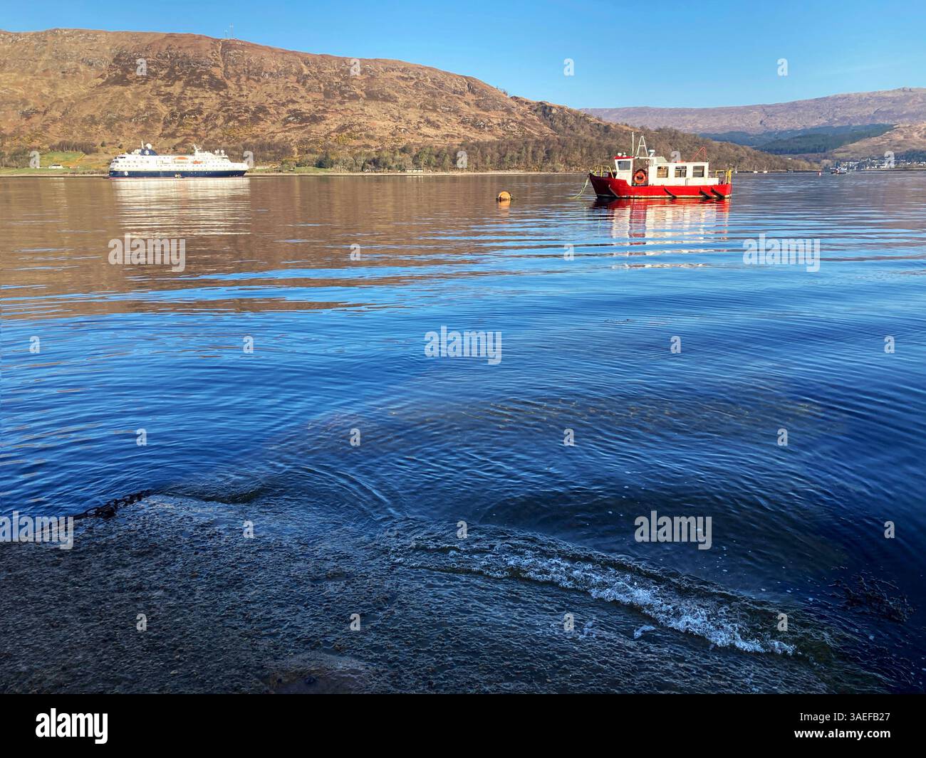 Cruise ship MS Spitsbergen anchored in Loch Linnhe, Fort William Scotland - Smartphone Captured Stock Image