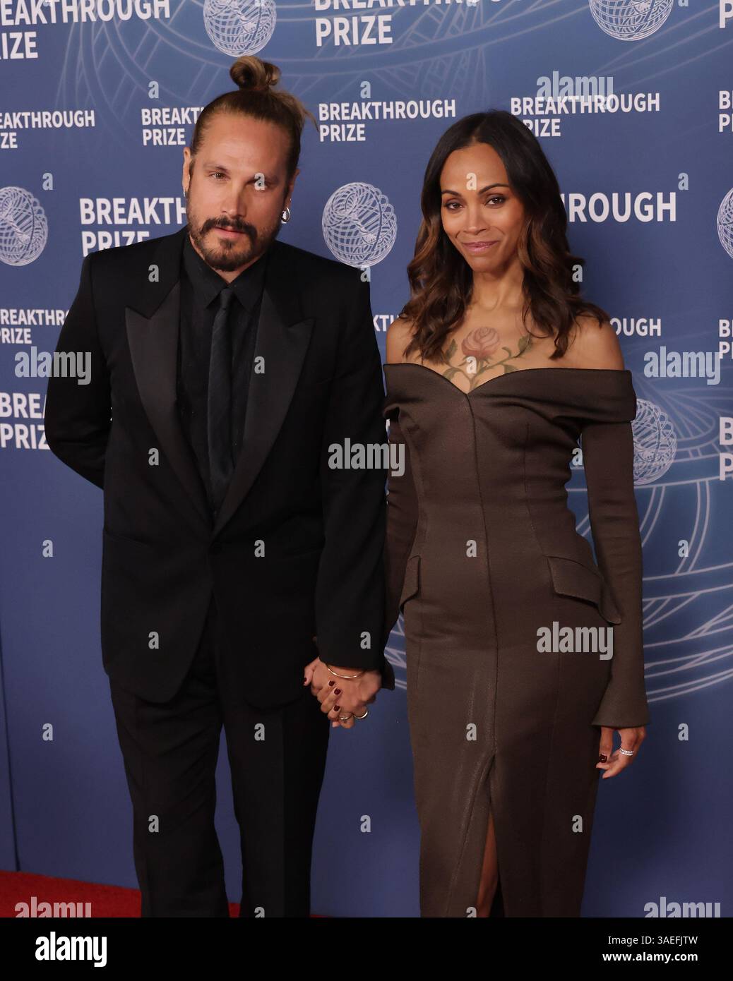 Perego Saldaña Santa Monica, USA. 06th Apr, 2025. Marco Perego, Zoe Saldaña attend the ...