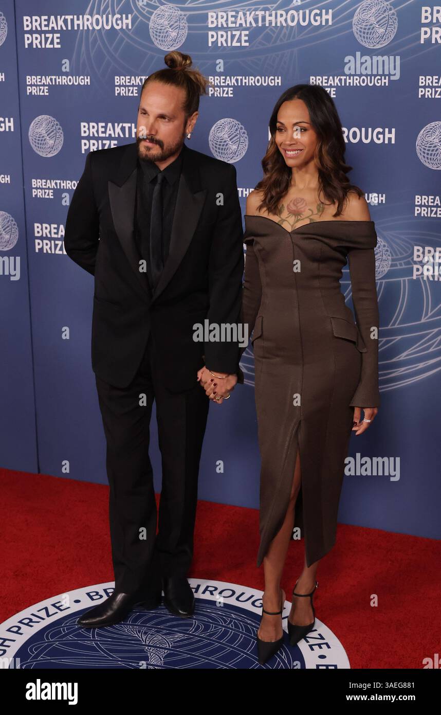 Santa Monica, USA. 06th Apr, 2025. Marco Perego, Zoe Saldaña attend the ...