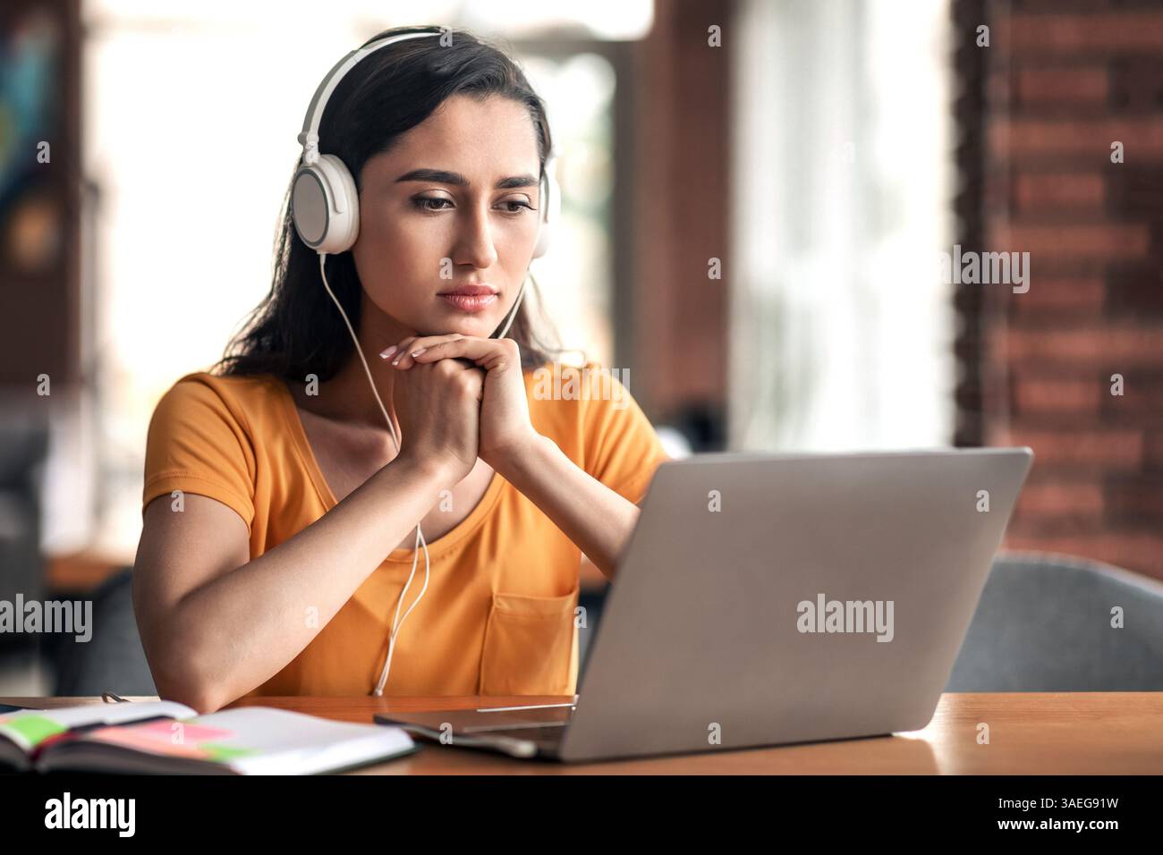 Concentrated young arab lady having educational course online Stock Photo