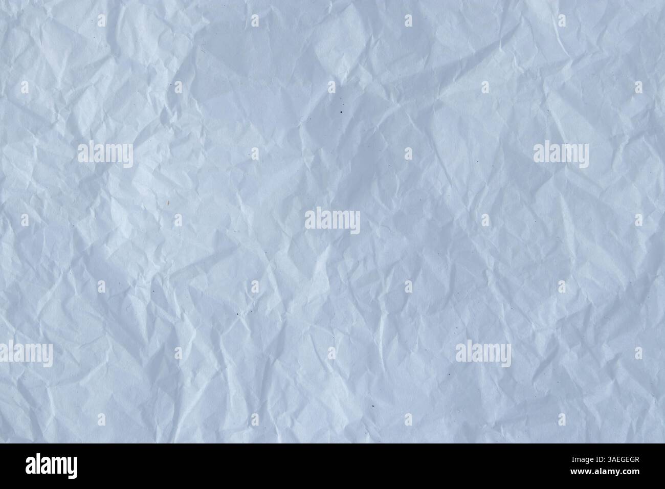 Recycled white crumpled packing paper texture. Black small particles on ...