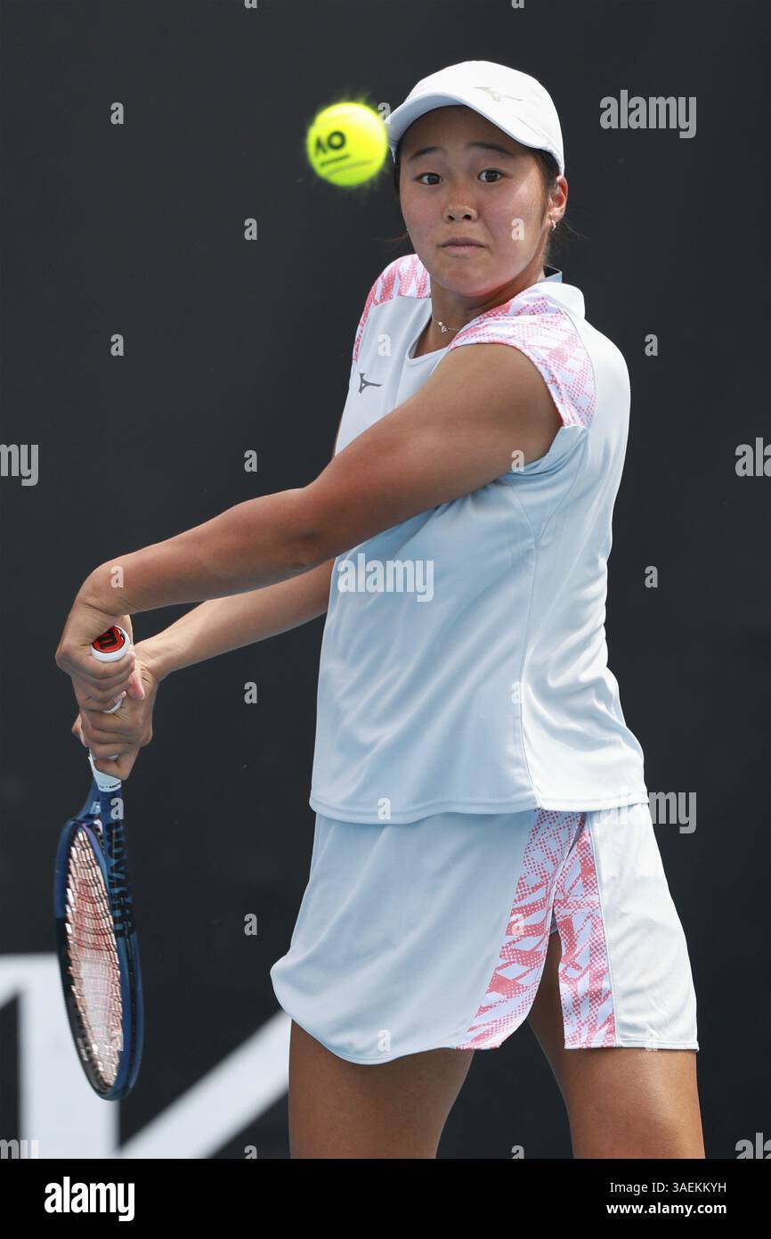 Japanese junior tennis player Wakana Sonobe (JPN) playing a backhand shot at the Australian Open 2025 tournament, Melbourne Park, Melbourne, Victoria Stock Photo
