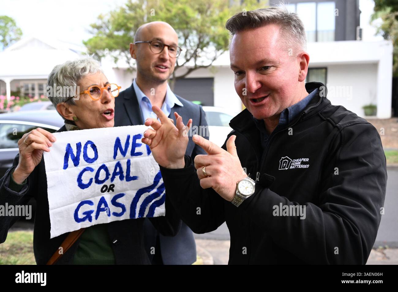 A protestor approaches Federal Minister for Climate Change and Energy ...