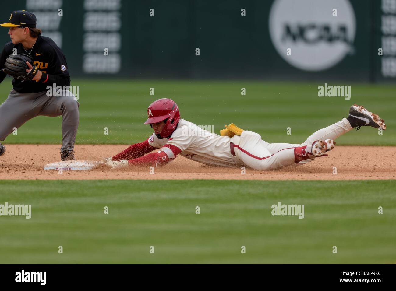 April 6, 2025: Wehiwa Aloy (9) of Arkansas makes a head first slide ...
