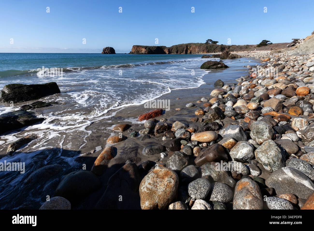 Rocks cover the surfline along the beach at Andrew Molera State Park in the Big Sur area of the Southern California Coast. Stock Photo