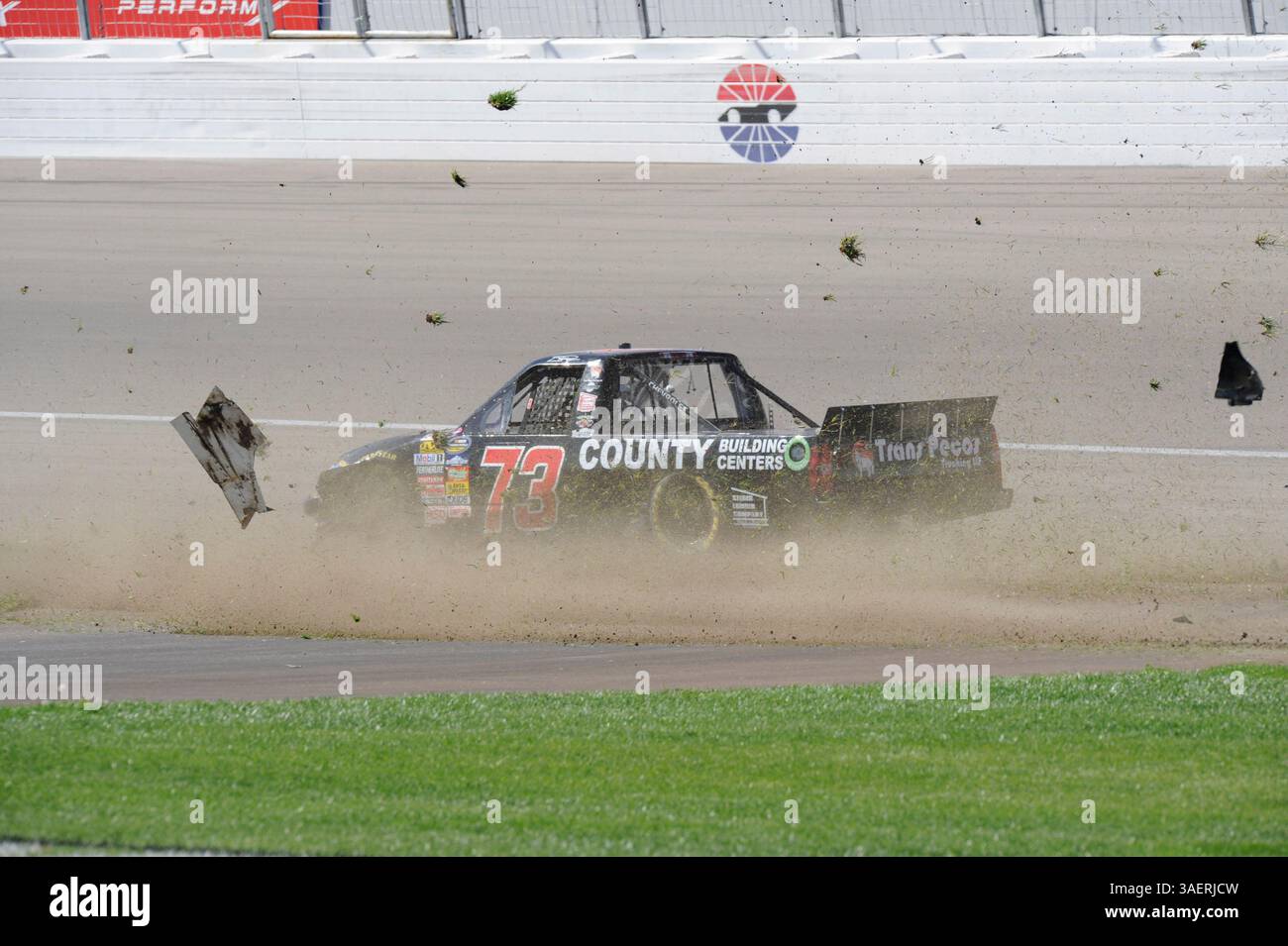 2011 OCT 15: Brent Raymer (73) Trans Pecos / County Building Centers Chevrolet chews up the infield grass while spinning out of control during the Smiths 350 NASCAR Camping World Truck Series auto race at Las Vgeas Motor Speedway in Las Vegas, NV(Credit Image: © Josh Holmberg/Cal Sport Media/ZUMAPRESS.com) Stock Photo