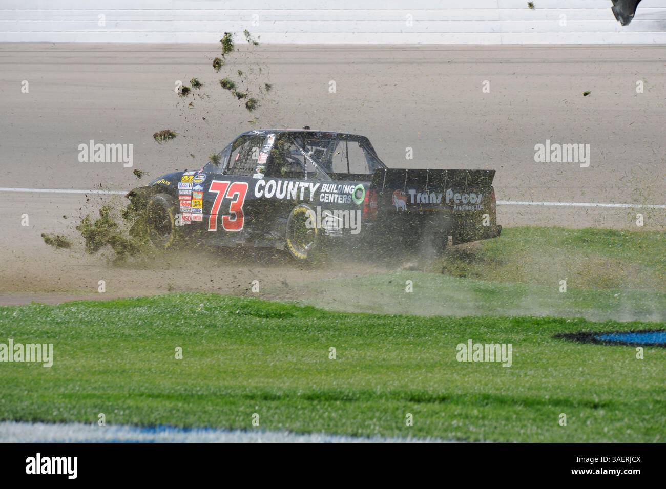 2011 OCT 15: Brent Raymer (73) Trans Pecos / County Building Centers Chevrolet chews up the infield grass while spinning out of control during the Smiths 350 NASCAR Camping World Truck Series auto race at Las Vgeas Motor Speedway in Las Vegas, NV(Credit Image: © Josh Holmberg/Cal Sport Media/ZUMAPRESS.com) Stock Photo