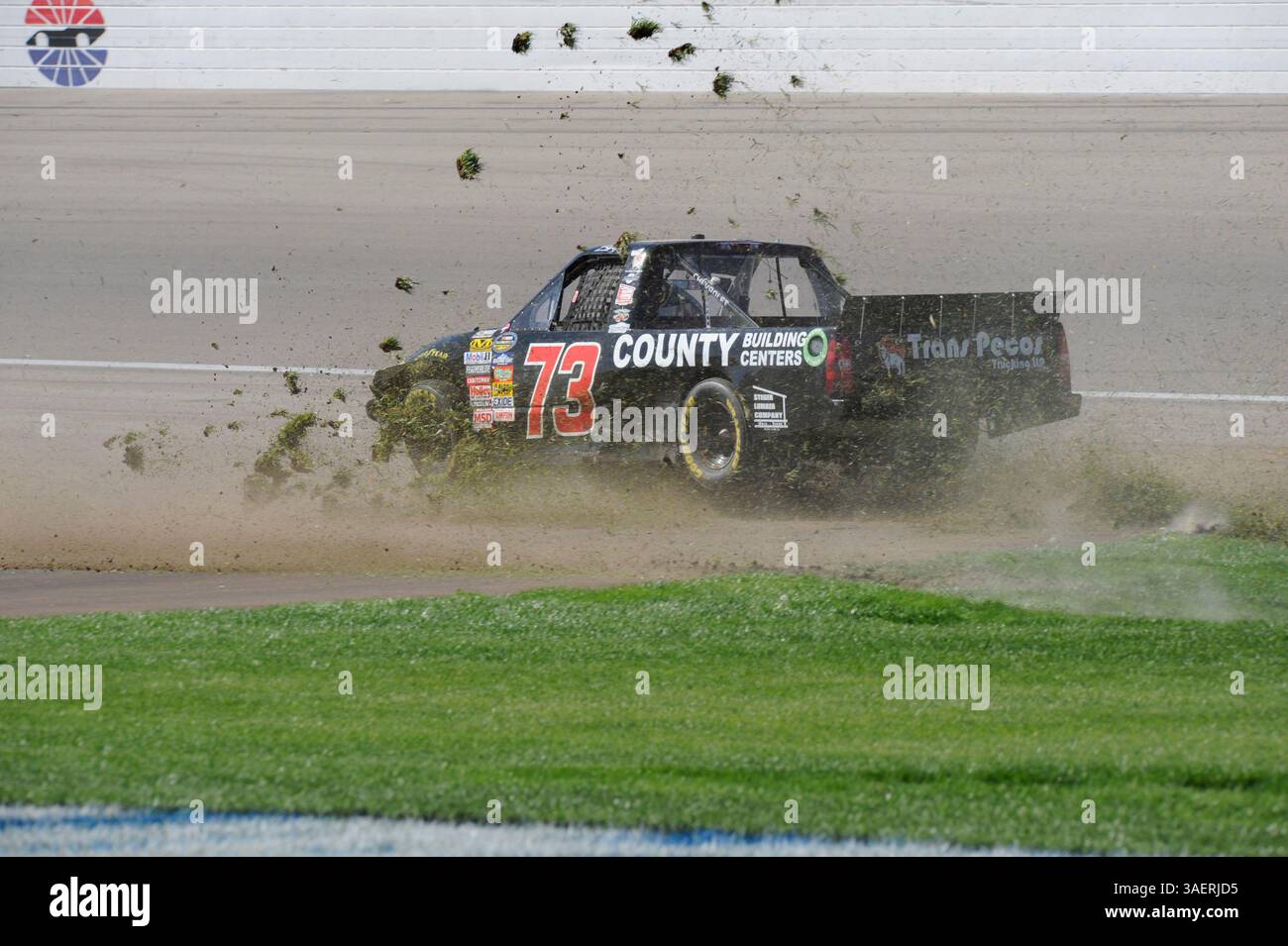 2011 OCT 15: Brent Raymer (73) Trans Pecos / County Building Centers Chevrolet chews up the infield grass while spinning out of control during the Smiths 350 NASCAR Camping World Truck Series auto race at Las Vgeas Motor Speedway in Las Vegas, NV(Credit Image: © Josh Holmberg/Cal Sport Media/ZUMAPRESS.com) Stock Photo