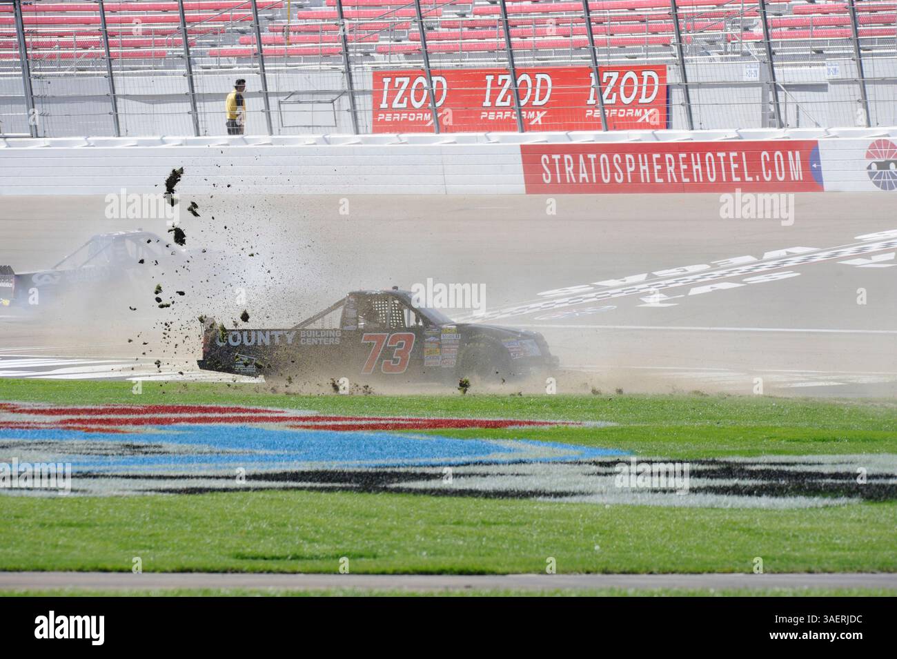2011 OCT 15: Brent Raymer (73) Trans Pecos / County Building Centers Chevrolet chews up the infield grass while spinning out of control during the Smiths 350 NASCAR Camping World Truck Series auto race at Las Vgeas Motor Speedway in Las Vegas, NV(Credit Image: © Josh Holmberg/Cal Sport Media/ZUMAPRESS.com) Stock Photo