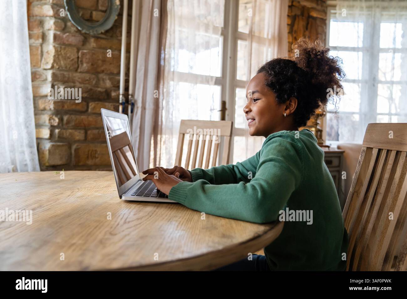 African girl student watching video course, distance e-learning, studying with online teacher Stock Photo