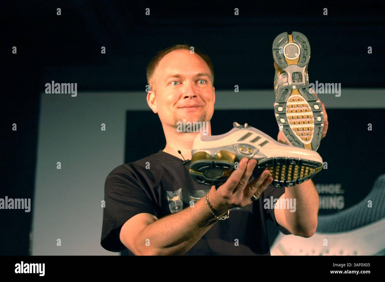 Andreas Gellner, Managing Director Adidas India Marketing Pvt. Ltd. poses  for the media with the Adidas-1 shoes during the launch in India, in New  Delhi, Wednesday, April 27, 2005. According to a