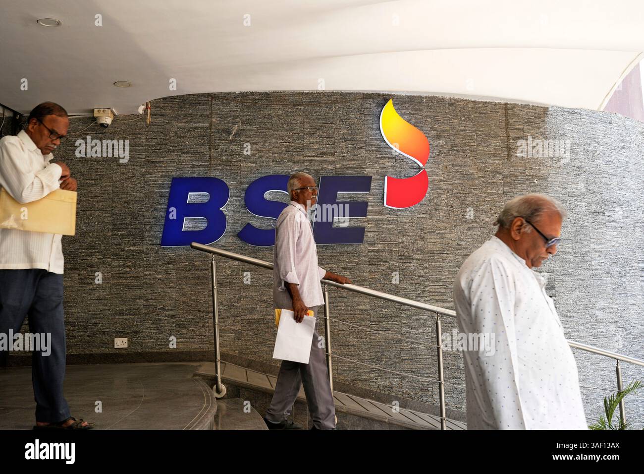 People come out from Bombay Stock Exchange (BSE) building in Mumbai ...