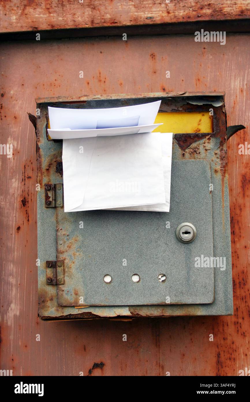 Old rusted post mail box Stock Photo