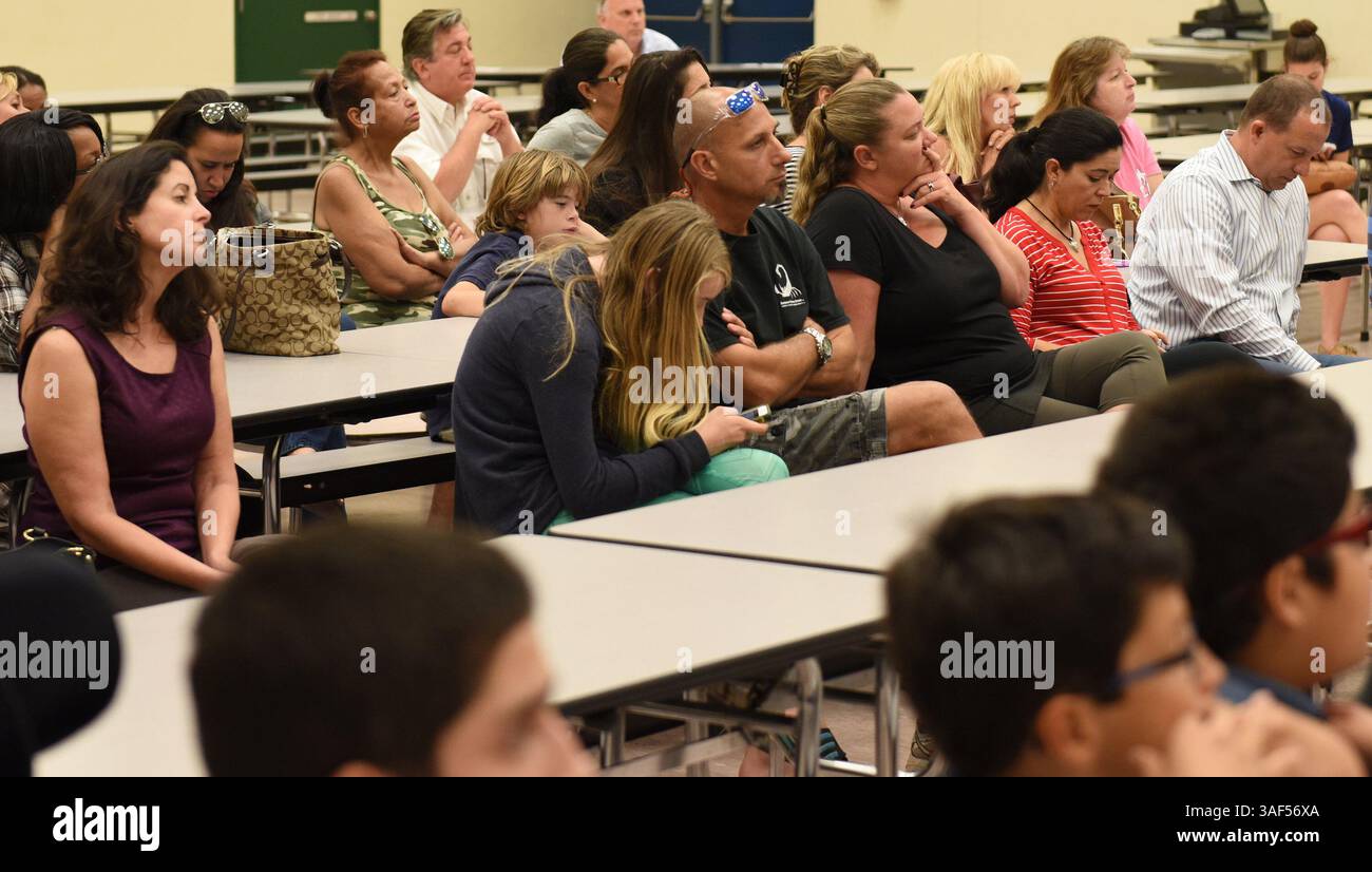 Mar 2, 2015 - Fort Lauderdale, Florida, U.S. - Concerned parents attend a meeting with Sunrise Middle School Principal MICHAEL WALKER at the school's cafeteria on Monday in reference to a Class A weapon found on a student last week. Sunrise Middle student had a gun, knife, ammunition, mask and fireworks in his book bag on campus, according to a police report. The 13-year-old boy was taken into custody last Friday and committed under Florida's Baker Act, according to the report. Police have not named the student because of his age. (Credit Image: © Jim Rassol/TNS/ZUMAPRESS.com) Stock Photo