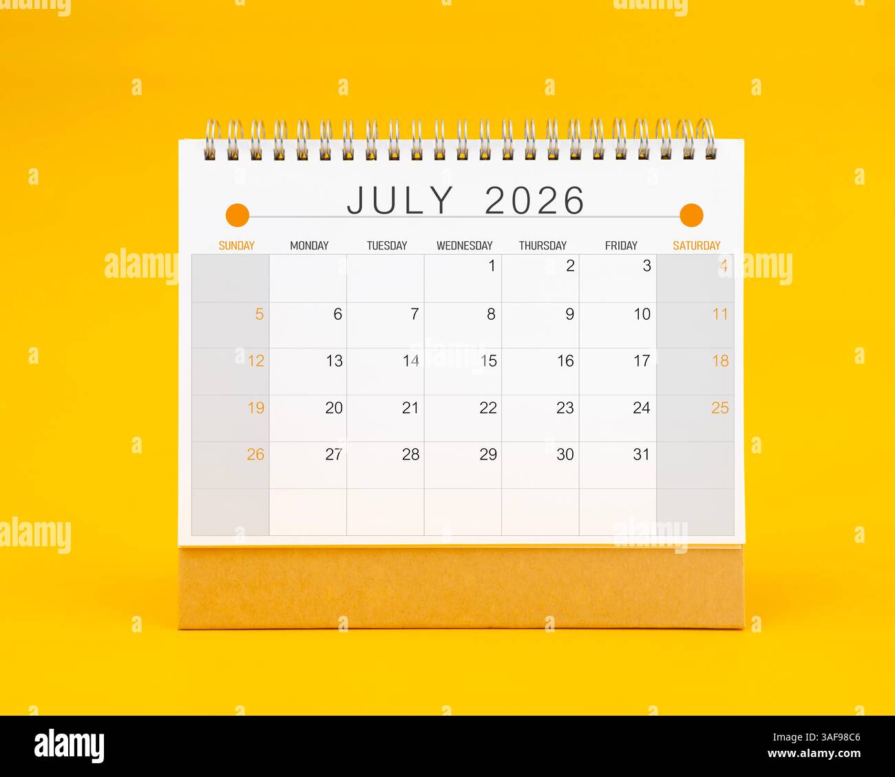 July 2026 desk calendar on yellow color background, Fro…
