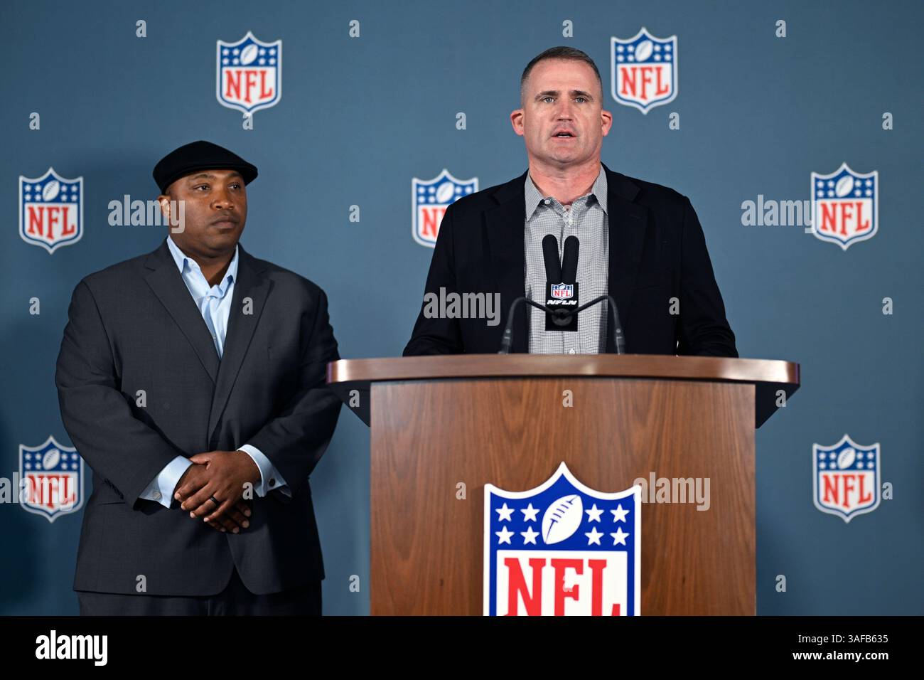Denver Broncos football special teams coordinator Darren Rizzi, right ...
