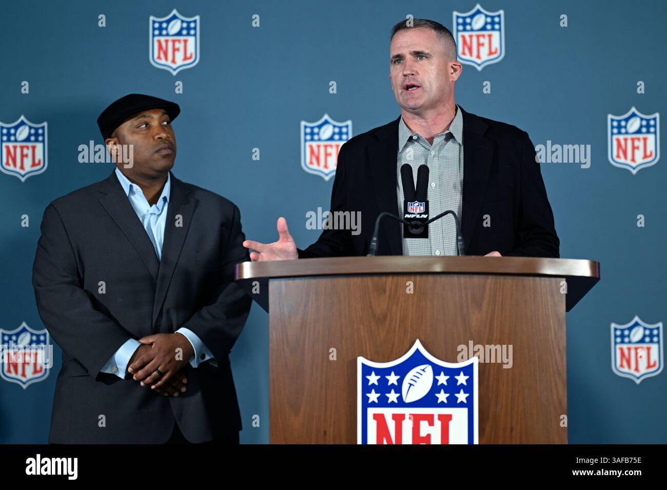 Denver Broncos football special teams coordinator Darren Rizzi, right ...