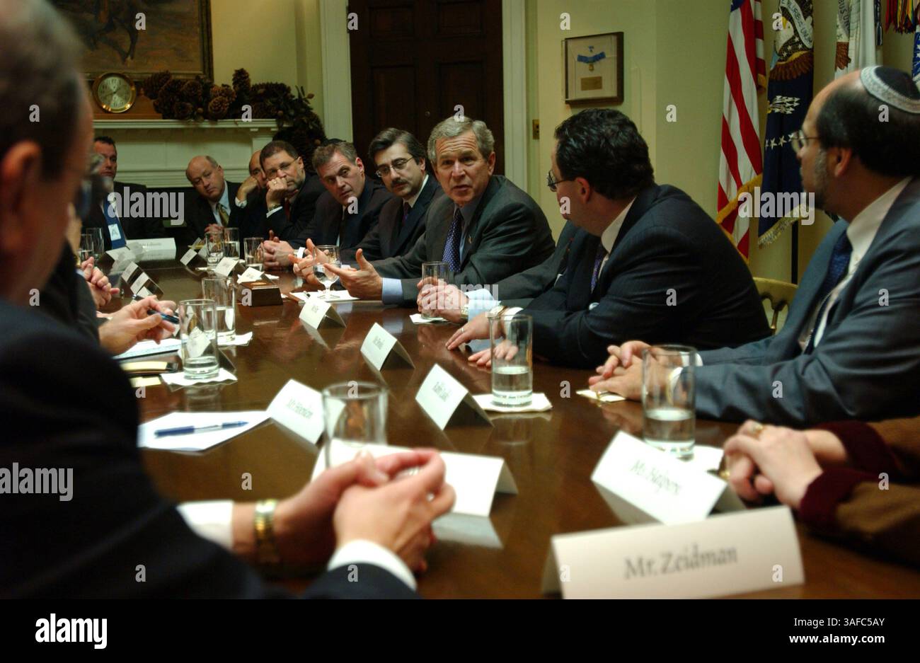 Dec 20, 2003; Washington, DC, USA; President GEORGE W. BUSH meets with a group of Jewish community leaders and Rabbis in the Roosevelt Room. Present at the meeting were Rabbi Dr. ELIE ABADIE, Rabbi KENNETH AUMAN, MATT BROOKS, LEW EISENBERG, SAM FOX, CHERYL HALPERN, MALCOLM HOENLEIN, STEPHEN HOFFMAN, HOWARD JONAS, JOEL KAPLAN, Rabbi DAVID KESSEL, Rabbi MOSHE KLETENICK, HOWARD KOHR, MICHAEL LEBOVITZ, Rabbi JACOB LUSKI, Rabbi BRUCE LUSTIG, JACK ROSEN, Rabbi YOSEPH SHEMTOV, Rabbi MICHAEL SIEGEL, JAMES TISCH, and FRED ZEIDMAN..  (Credit Image: ZUMA Press/ZUMAPRESS.com) Stock Photo