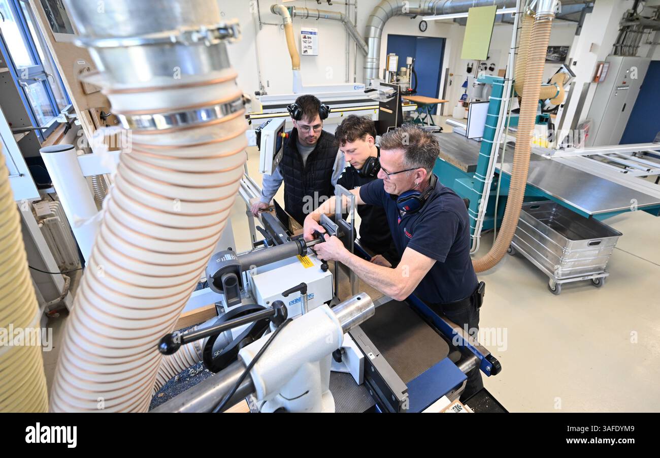 Stuttgart, Germany. 07th Apr, 2025. Trainees work on a workpiece in a ...