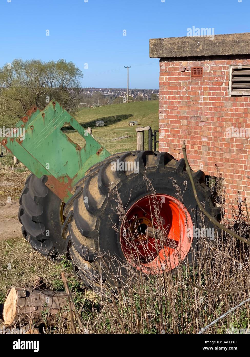 Eastern on the Hill woods farm land pretty walk walking outside tractor wheels wheel sign post signs trees pretty Summer Spring wooded area nice - Smartphone Captured Stock Image