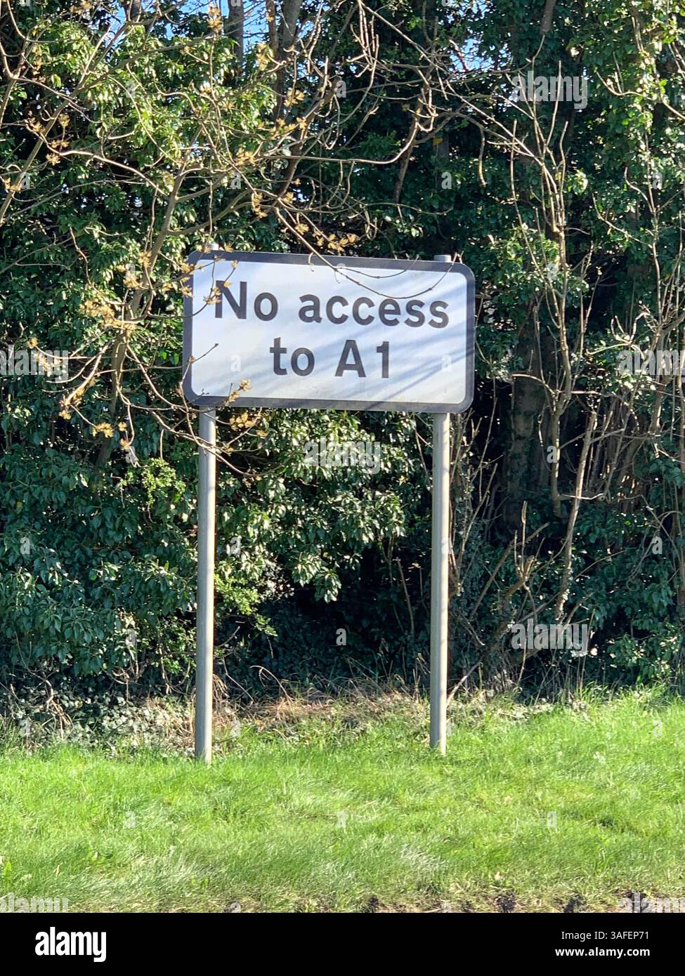 Eastern on the Hill woods farm land pretty walk walking outside tractor wheels wheel sign post signs trees pretty Summer Spring wooded area nice - Smartphone Captured Stock Image