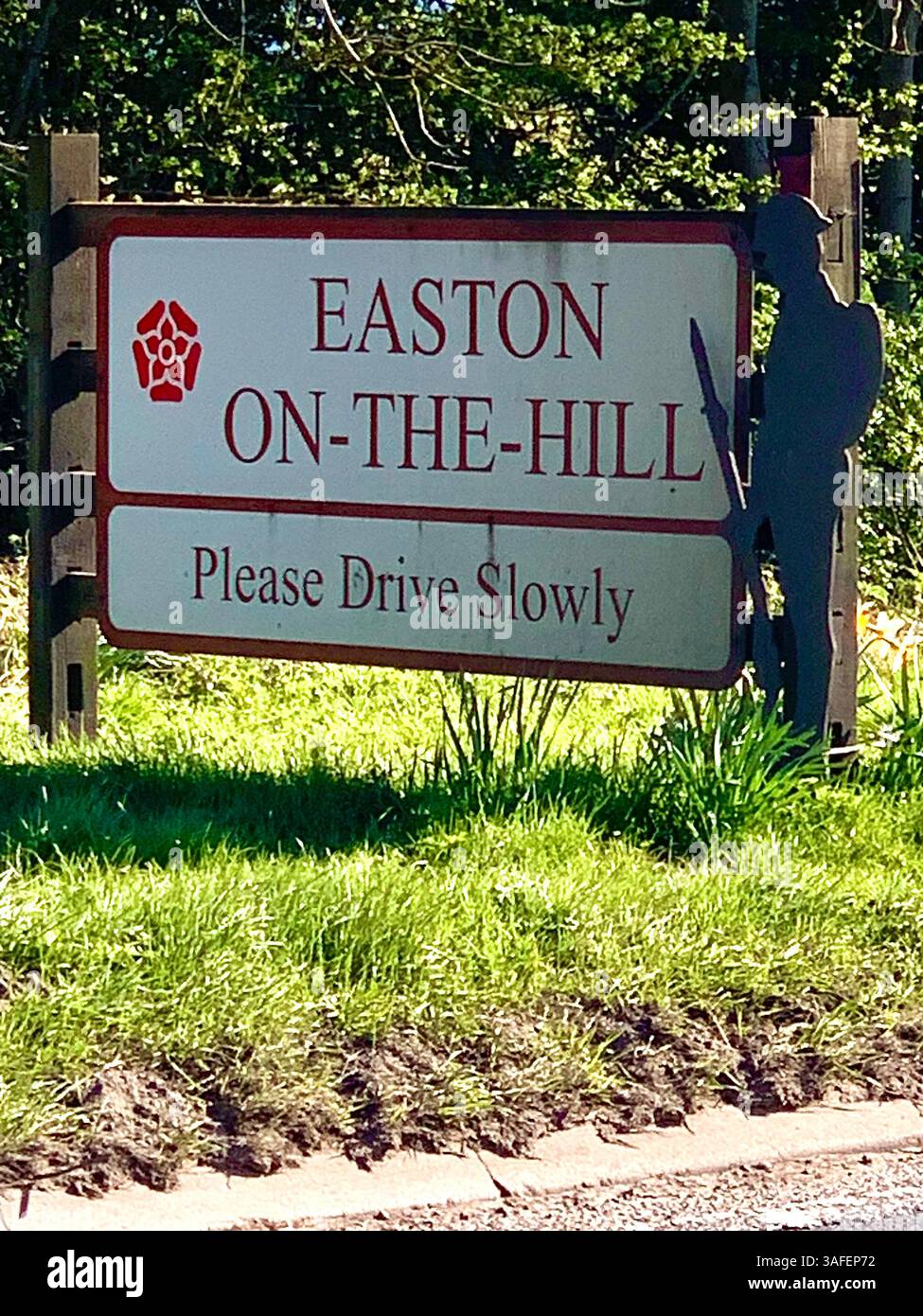 Eastern on the Hill woods farm land pretty walk walking outside tractor wheels wheel sign post signs trees pretty Summer Spring wooded area nice - Smartphone Captured Stock Image