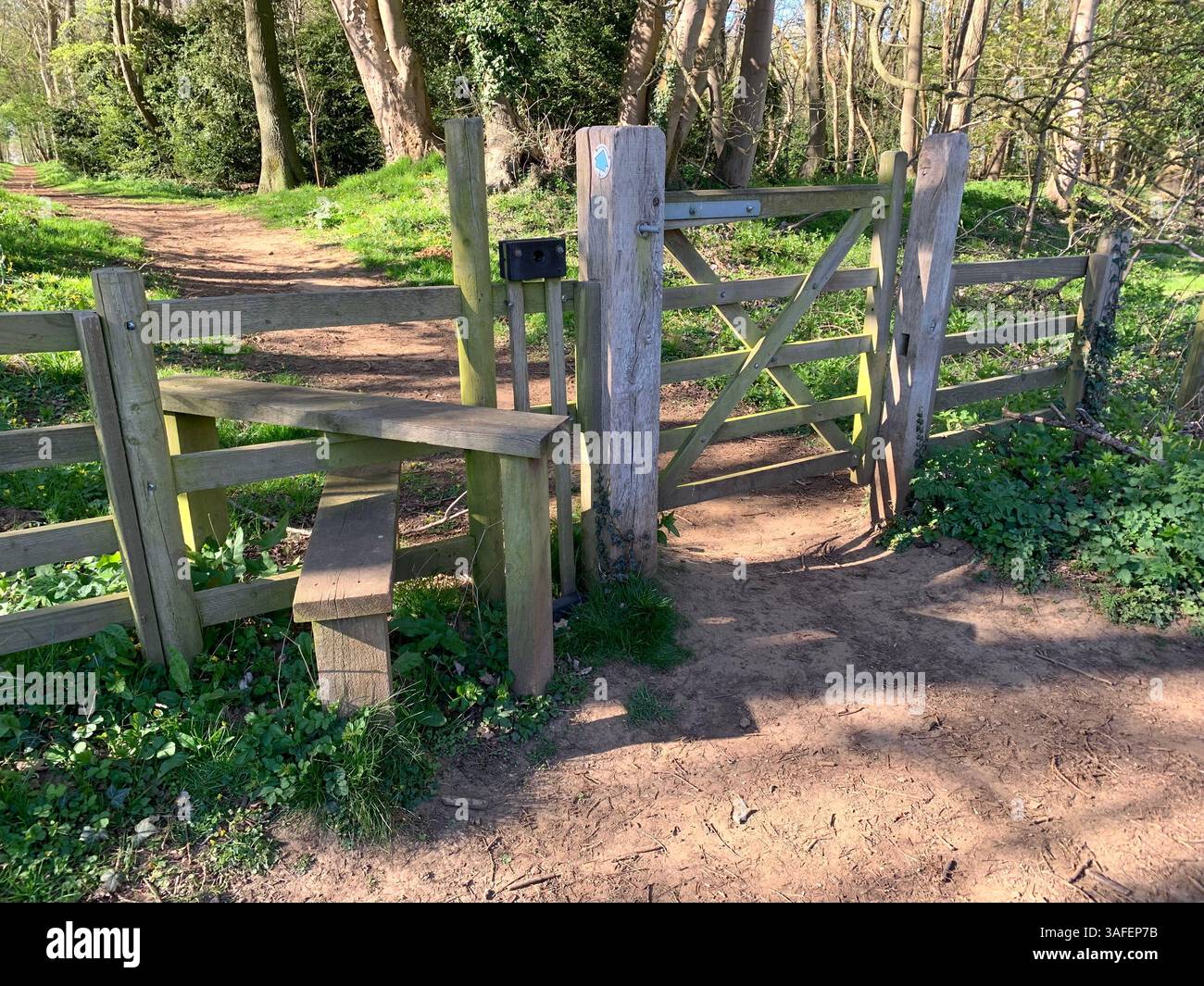 Eastern on the Hill woods farm land pretty walk walking outside tractor wheels wheel sign post signs trees pretty Summer Spring wooded area nice - Smartphone Captured Stock Image