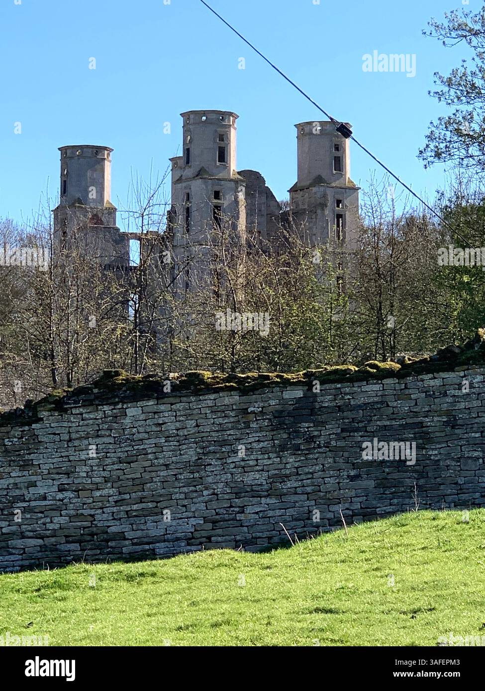 Eastern on the Hill woods farm land pretty walk walking outside tractor wheels wheel sign post signs trees pretty Summer Spring wooded area nice - Smartphone Captured Stock Image