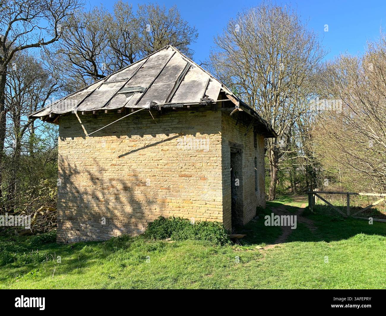 Eastern on the Hill woods farm land pretty walk walking outside tractor wheels wheel sign post signs trees pretty Summer Spring wooded area nice - Smartphone Captured Stock Image
