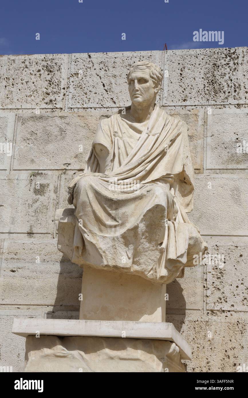 The statue of ancient Greek playwright Menander sitting by the Theatre ...