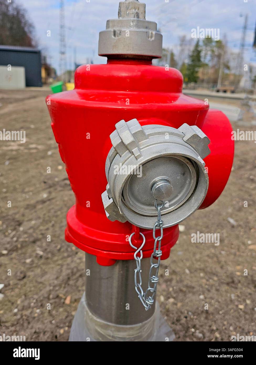 red fire hydrant on a construction site. close-up. Stock Photo