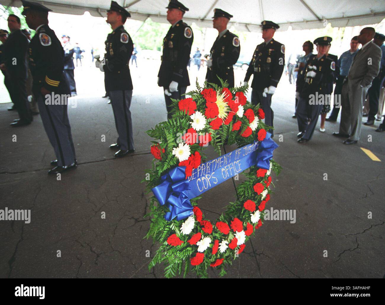 Officers from local law enforcement agencies wait in line to honor ...