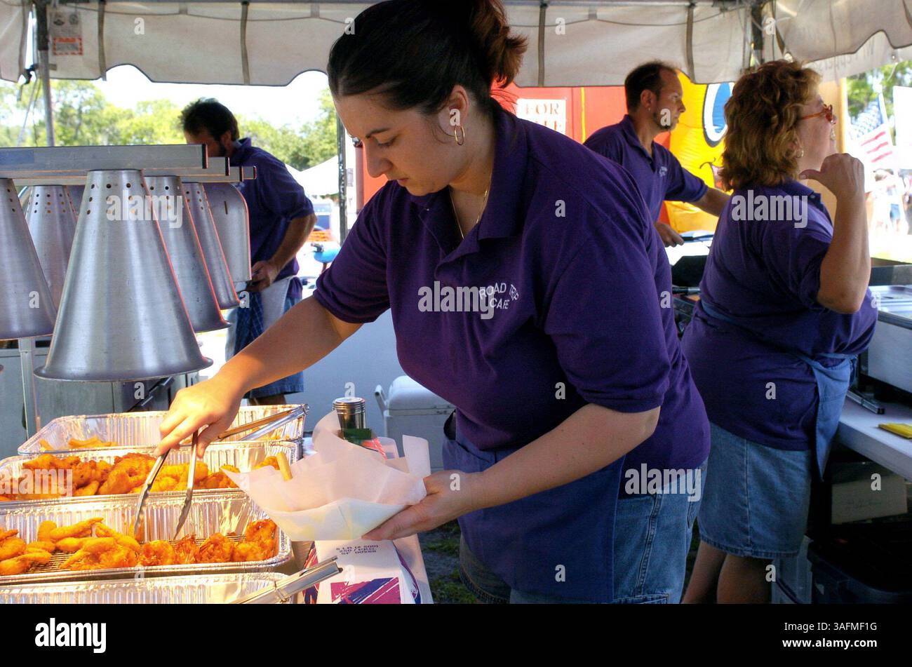 PHOTO 4/4: Dorene McNulty (cq left) , of St Petersburg, helps out at ...